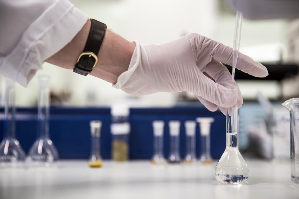 hands in a lab doing testing