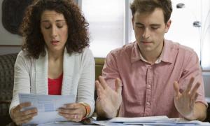 Young couple working through financial stress