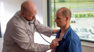 Man having his heart checked by a doctor